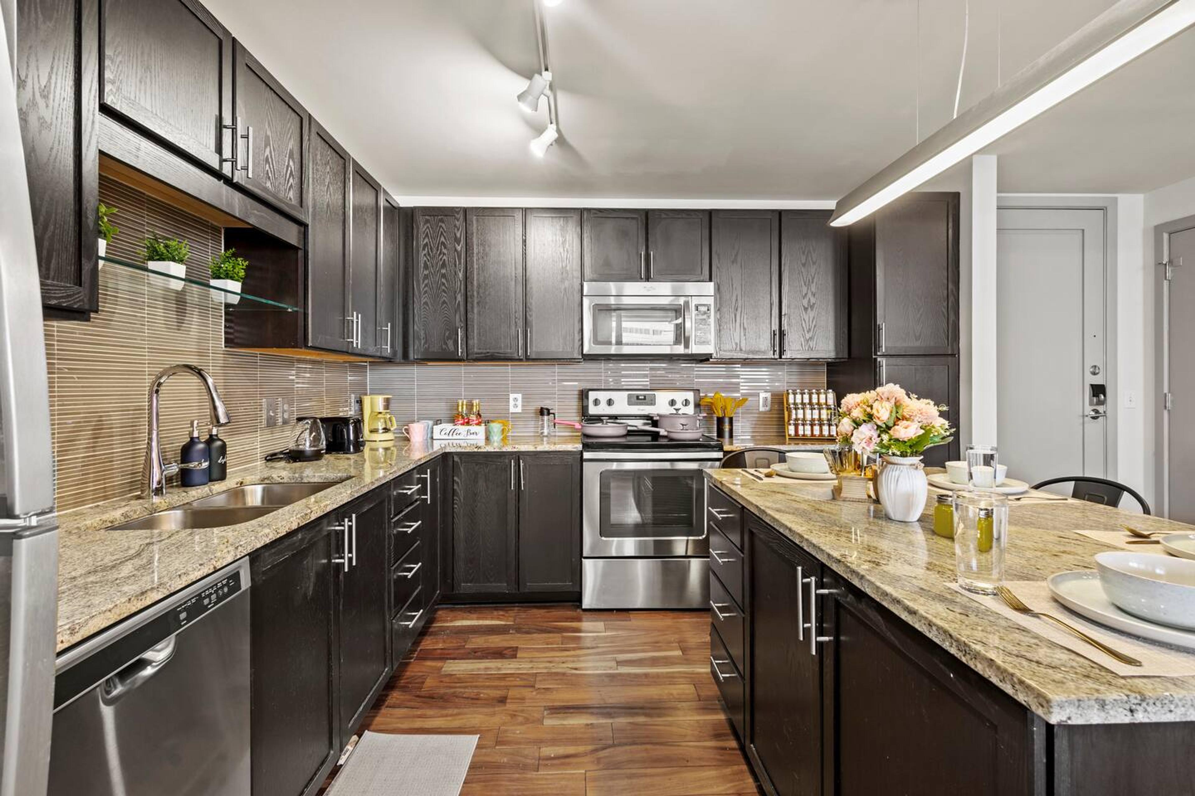 Kitchen
Fully equipped kitchen with microwave, stove, oven, refrigerator/freezer, dishwasher, toaster, sink with hot & cold water, trays, glasses, coffee, sugar, salt, olive oil, spices, silverware, pots and pans, coffee maker with essentials & more