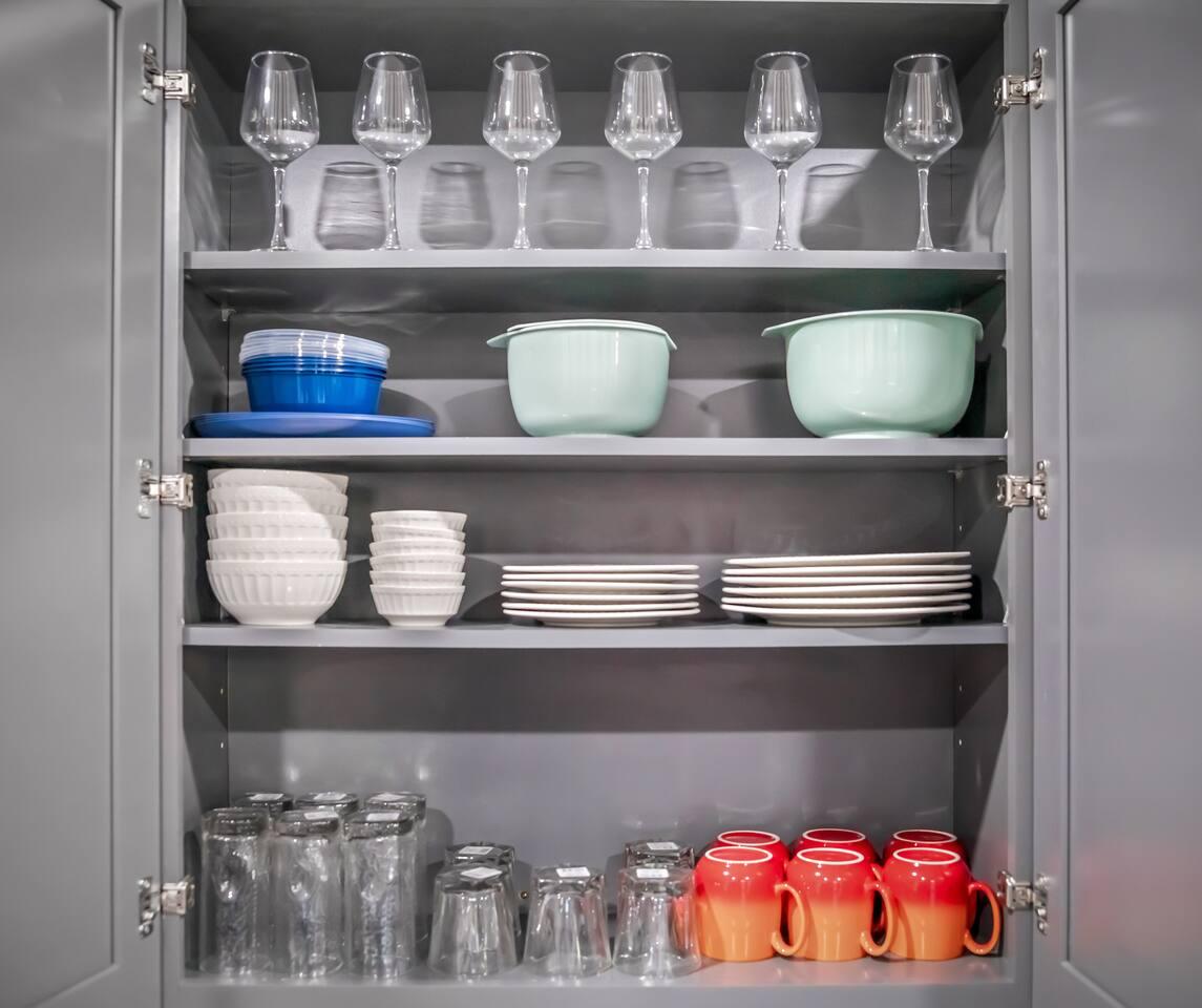 Fully Stocked Kitchen with : Wine glass, cups, bows, glasses, mugs and coffee station on the lower right. Also had bender , rice cooker and many pots for families to enjoy cooking during the stay.