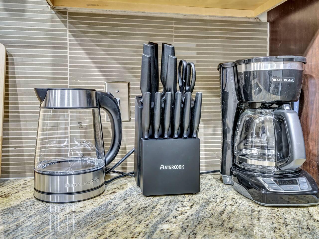 Kitchen amenities like coffee maker, kettle, knives and scissors for cutting your meat and veggies.
