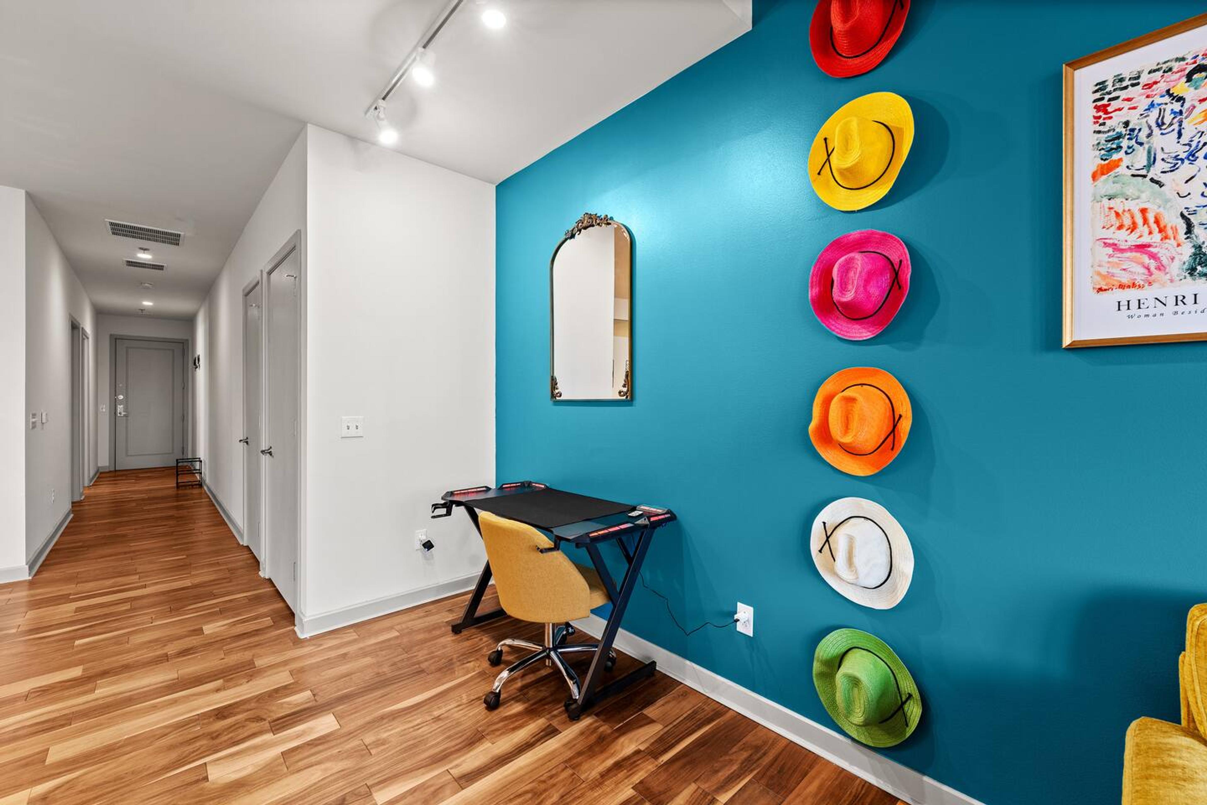 Work and glow! ✨ This colorful and fun workspace features a vanity mirror for a perfect blend of productivity and self-care.