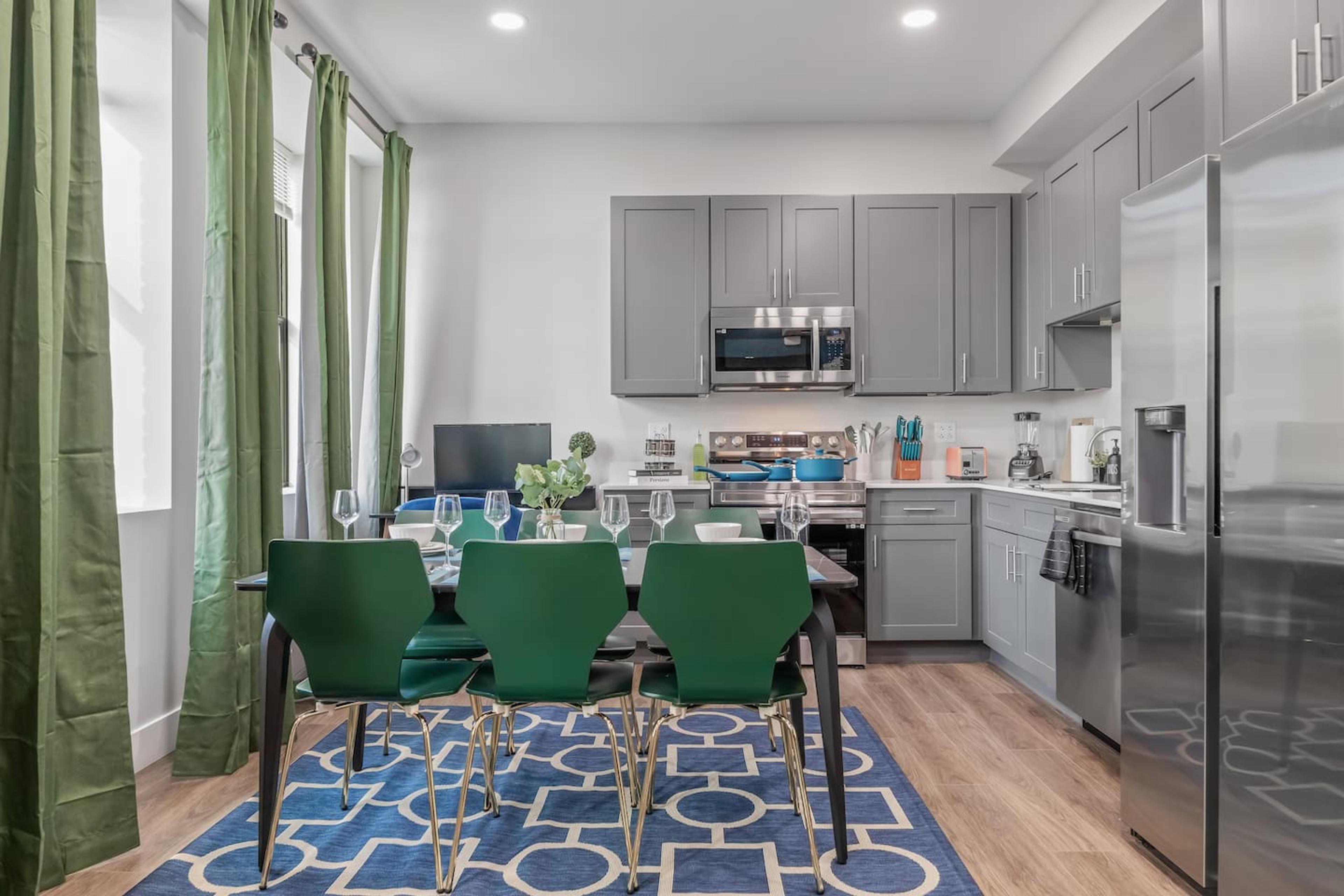 This dining room is perfect for entertaining. It has a large table that can seat six people comfortably.