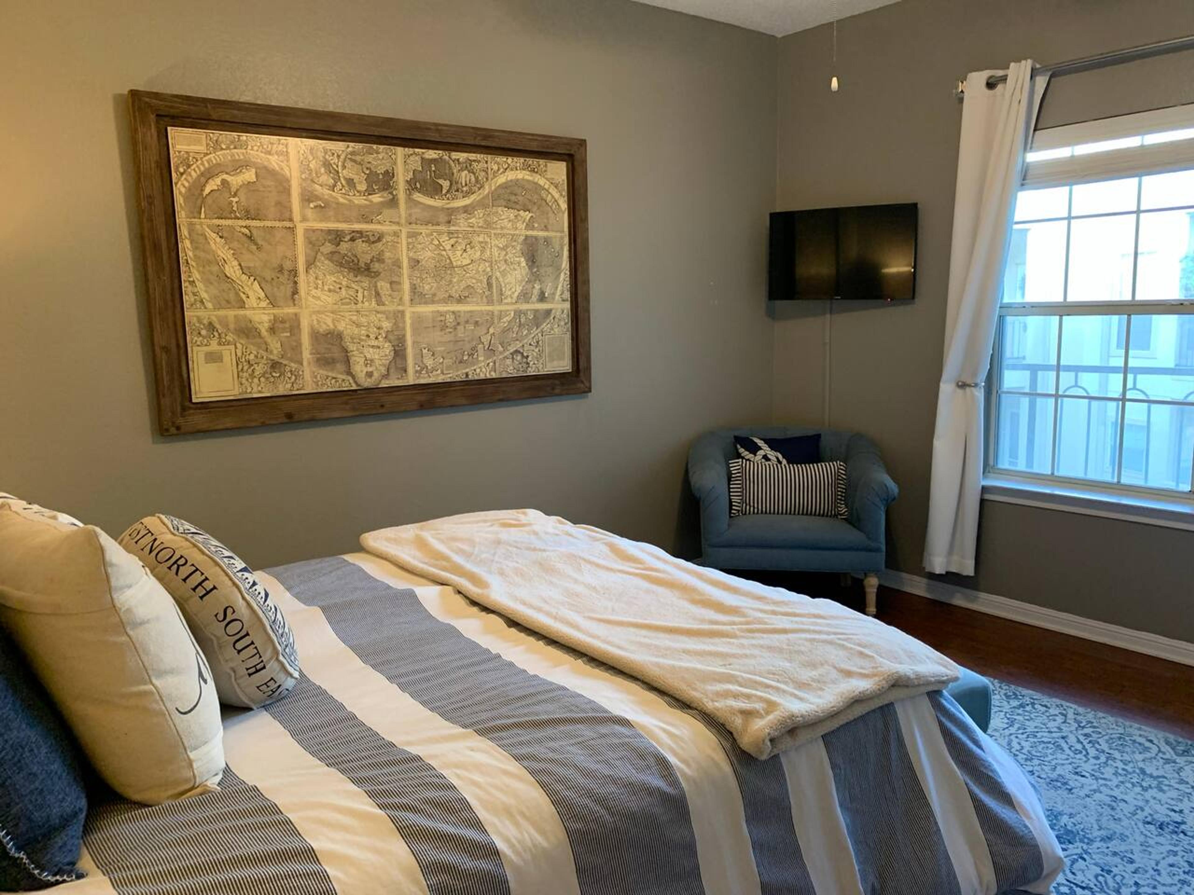 A Perfect cute spacious bedroom with one king bed that sleeps 2 adults. Designed with with comfort in mind and equipped with memory foam mattress, Cozy bedroom with nightstand