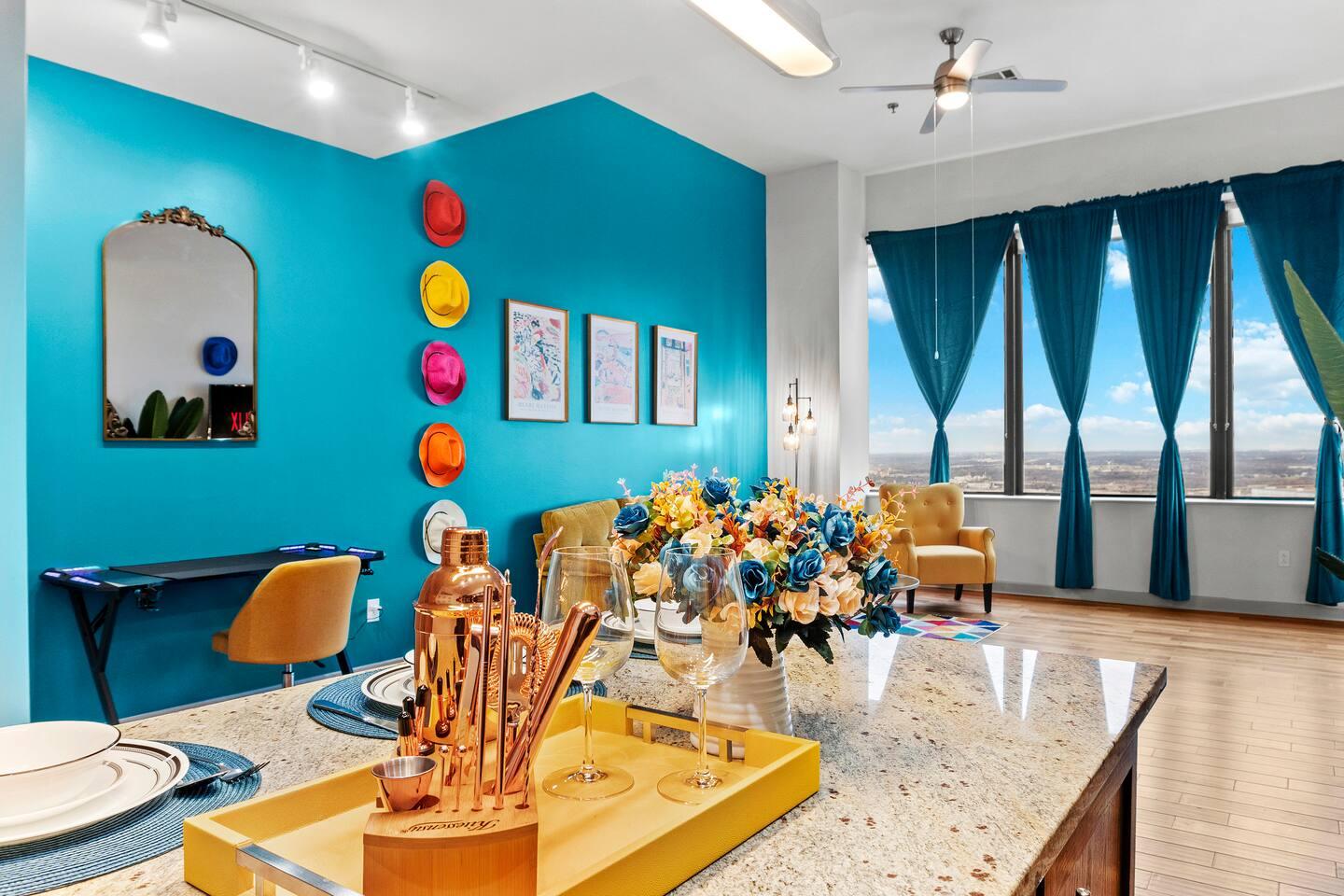 A vibrant living room with sofas and a beautiful city view from the room.