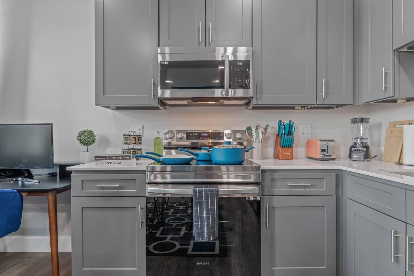 Clean kitchen with Pots, Pan, Knife set, Toaster, Blender, Spice rack, Kettle, cutting board , stainless steel appliance and many more !
