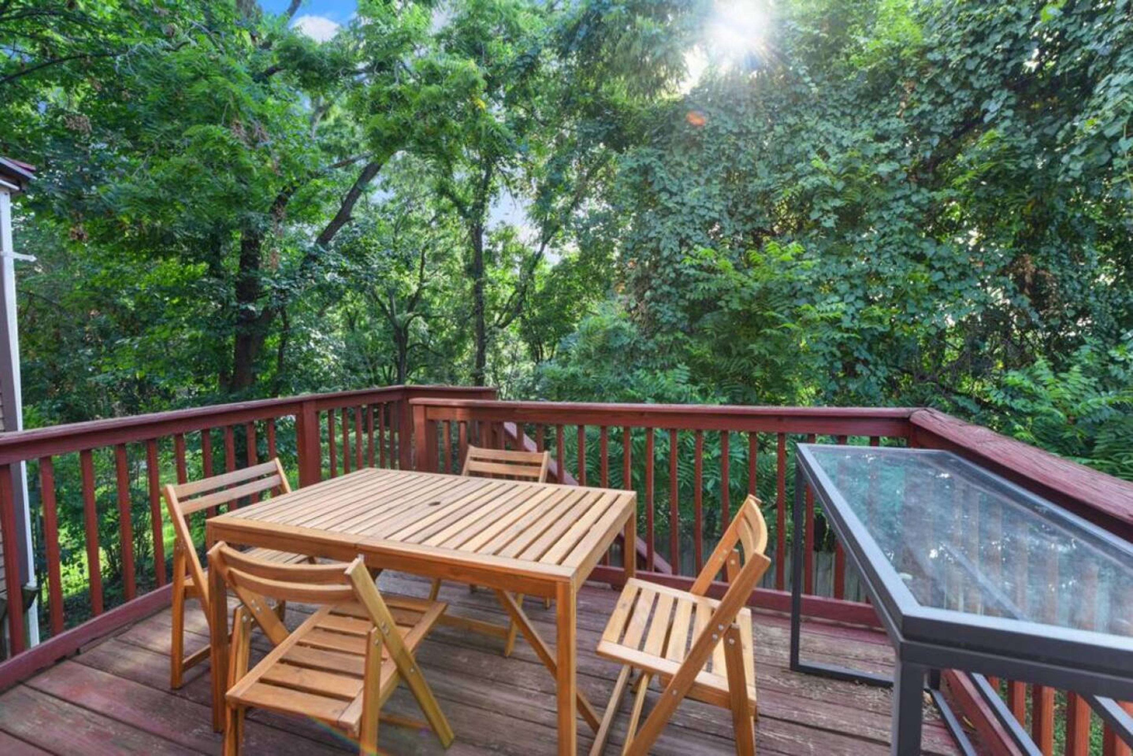Deck from Kitchen 
Enjoy the Perfect Blend of Sunlight and Tree-Filtered Shade on Our Serene Deck