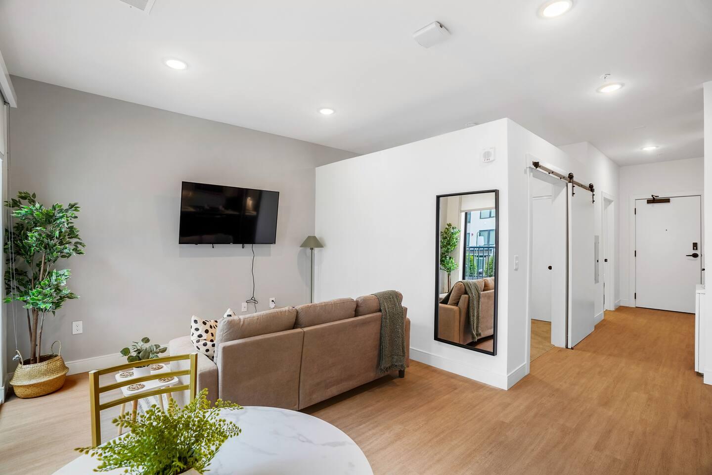 Effortlessly chic, our small studio living area is a cozy haven where clever design meets comfort, inviting you to unwind in a space that maximizes style without compromising on functionality.
