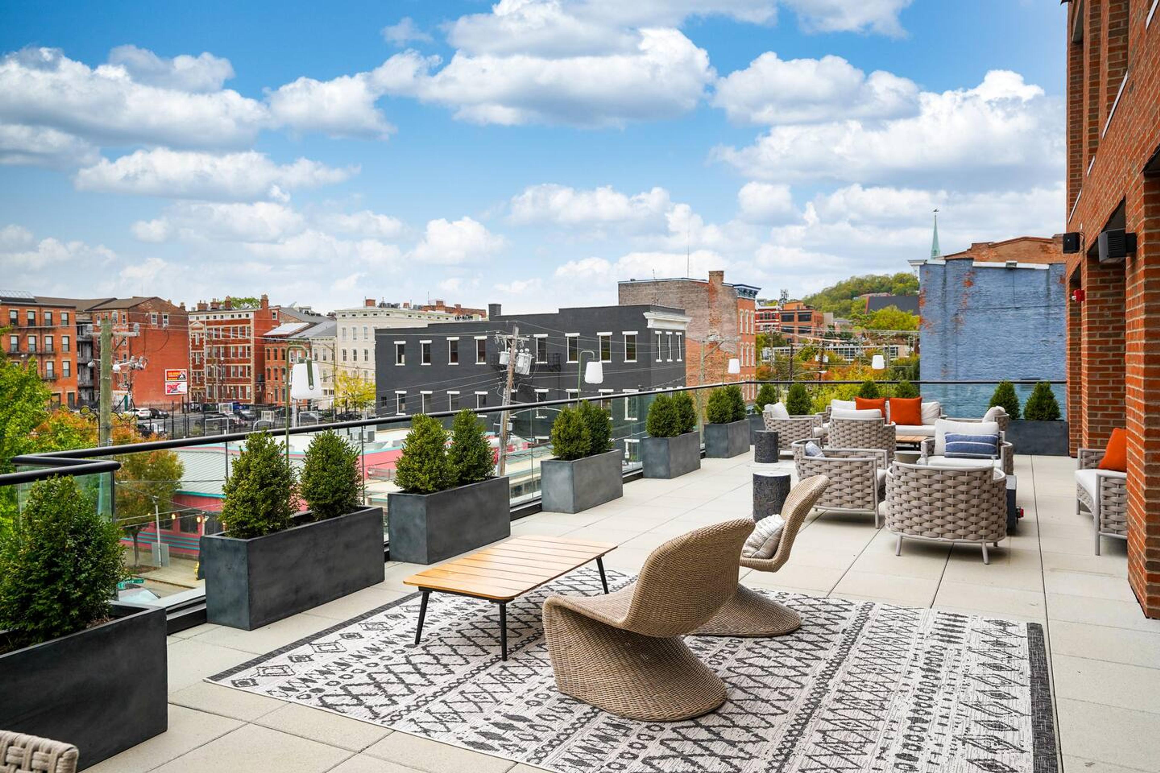 Common area: Patio with modern furniture, the atmosphere exudes a perfect blend of contemporary style and outdoor comfort.