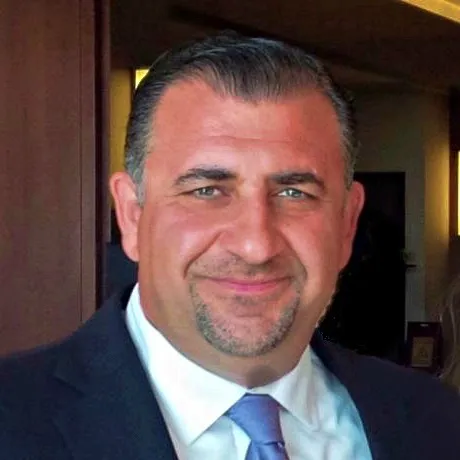 Portrait of Michael Arustamov, International Operations at Grayline Group