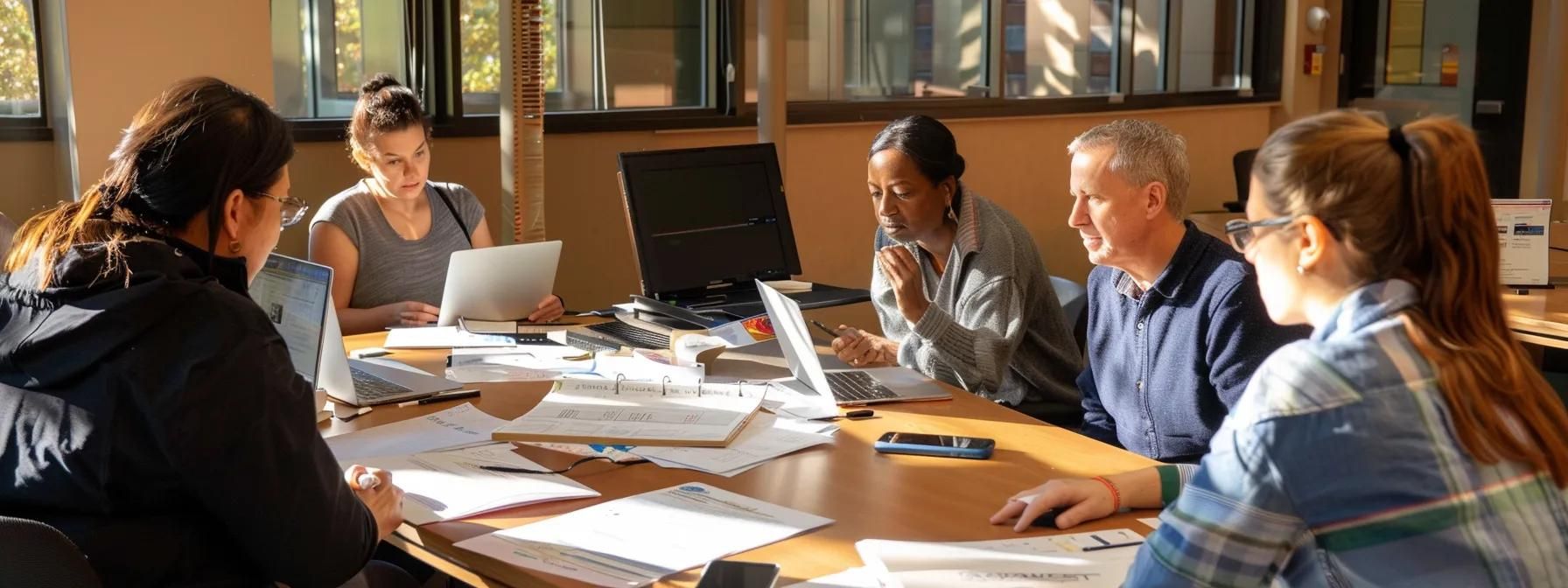 a group of diverse stakeholders gathered around a table, discussing project requirements and budget constraints with a stack of papers and laptops in front of them.