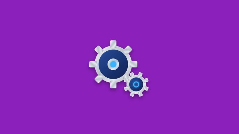Two interlocking silver cogs with a glowing blue core.