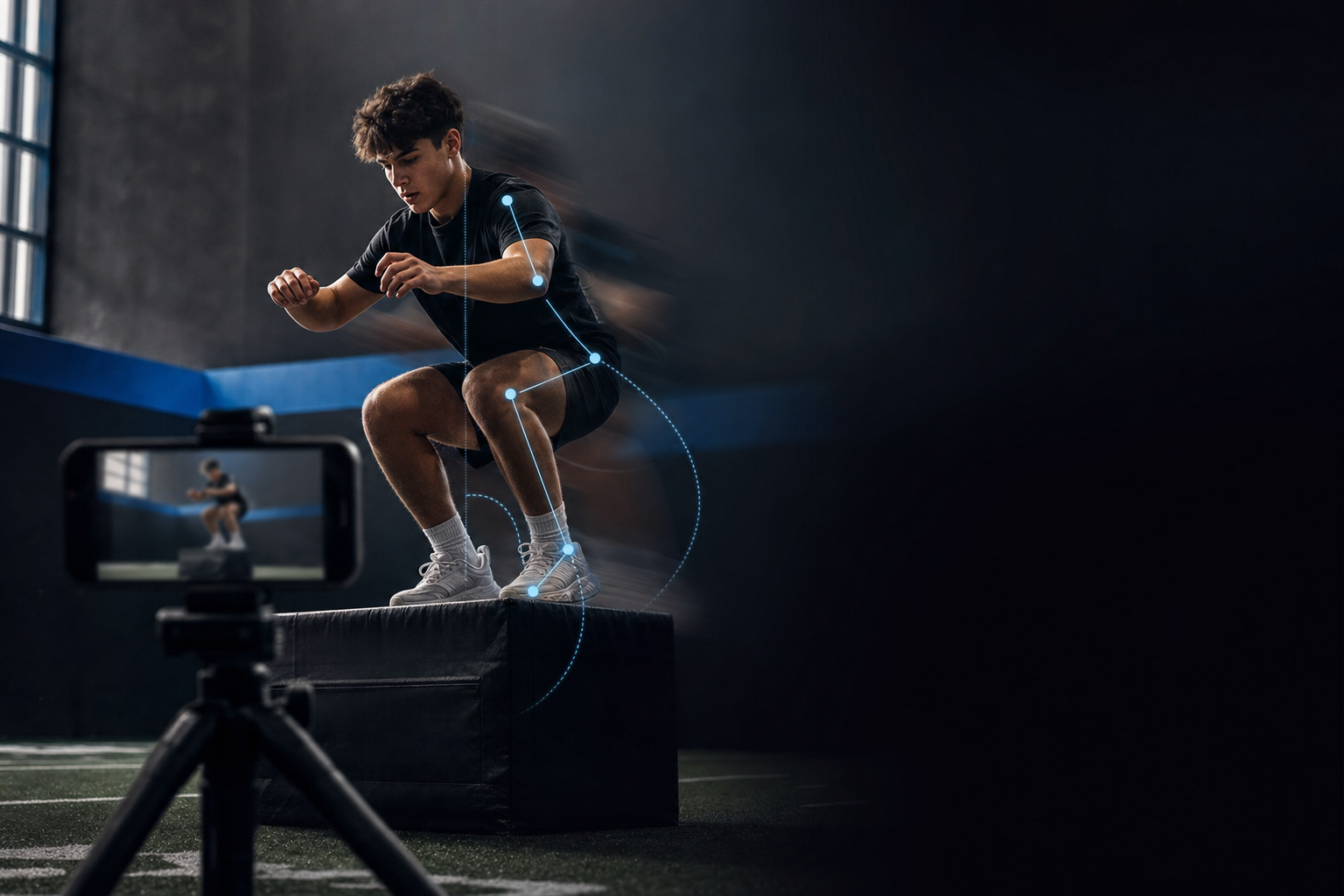 A young athlete crouched on a low plyo box in a dark gym, filmed by a phone on a tripod, with joint-angle guide lines overlaid on the legs and hips.