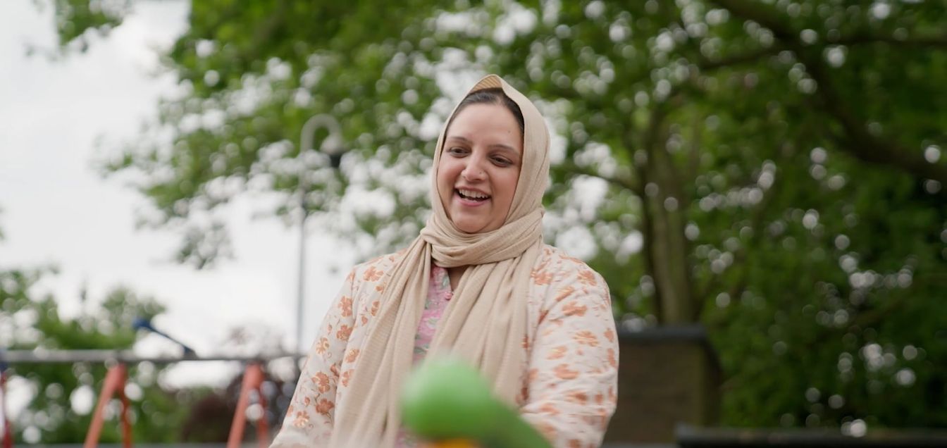 Saiqa at the park with her daughter