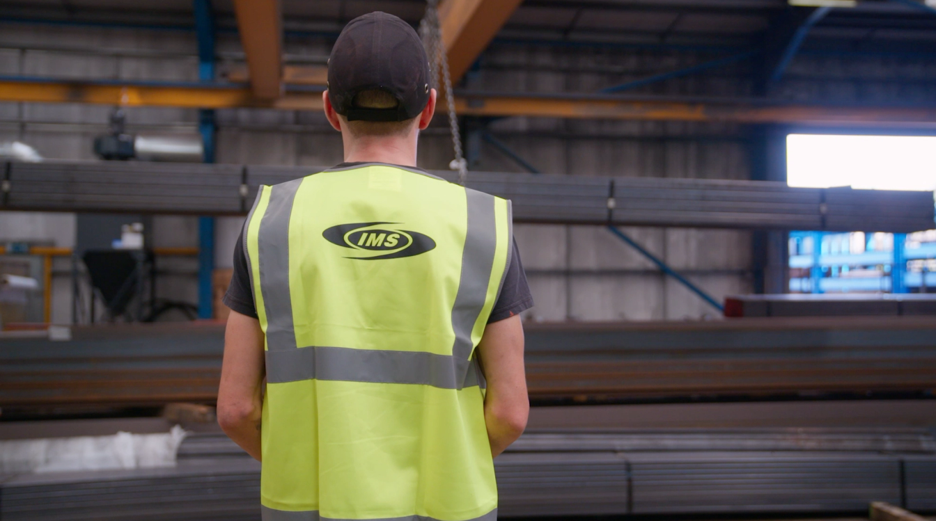 behind shot of IMS worker wearing hi vis behind shot of IMS worker wearing hi vis