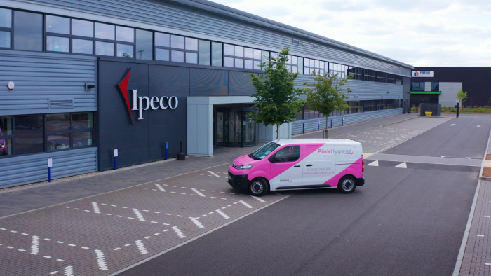 van pulling up to building