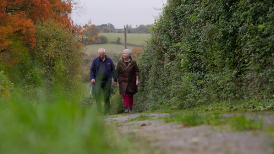 couple walking their dog