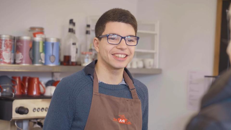 Young adult serving at coffee shop