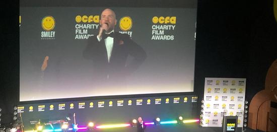 a photo of comedian Tom Allen hosting the Smiley Charity film awards 2023