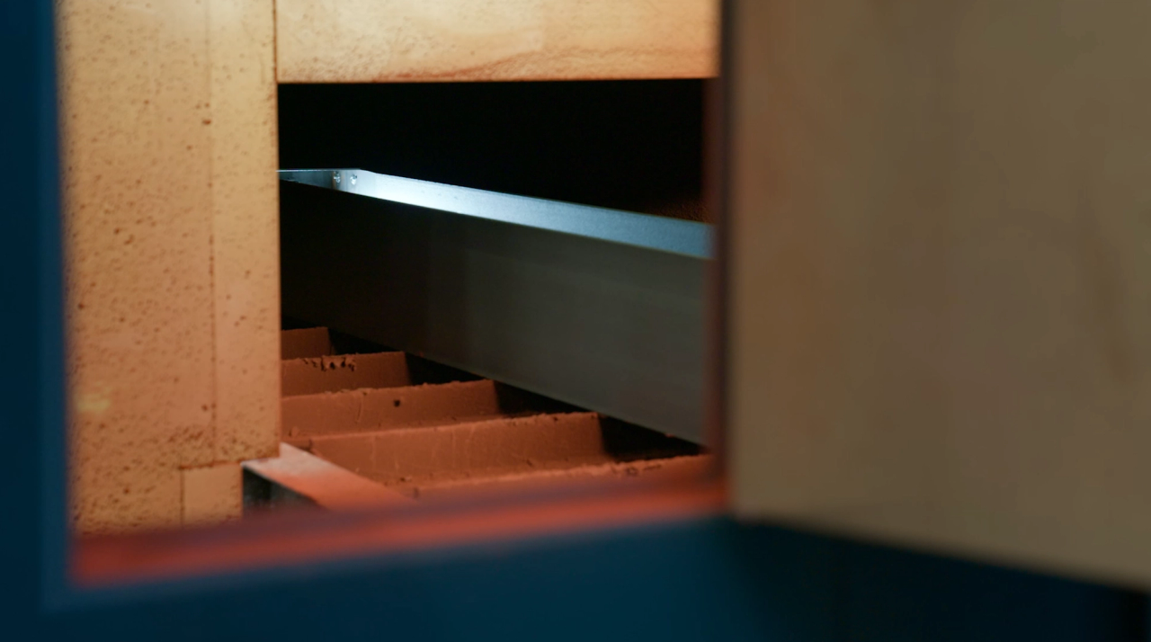 Steel Beam going through shot blaster at IMS