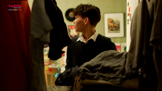 boy getting ready for school shot from inside wardrobe