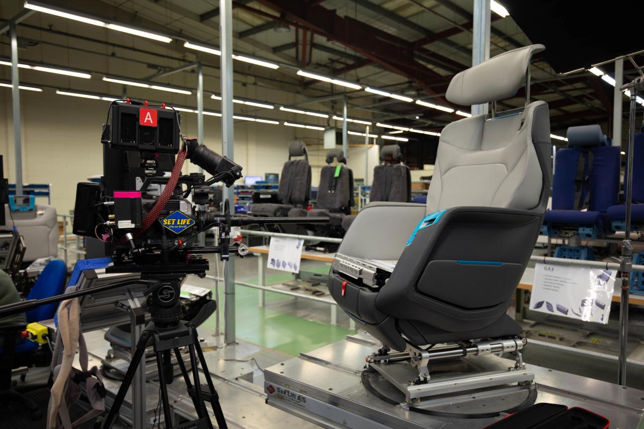 camera with probe lens capturing details of airplane seating 