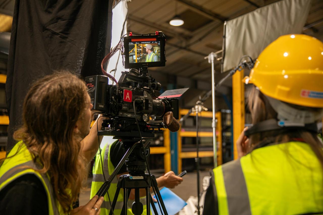 cameraman and producer with camera for an interview at IMS