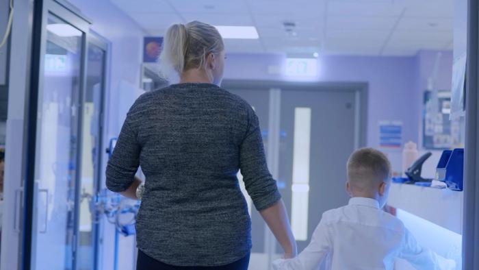 mum and son walking through new children's wards at Southampton Hospital