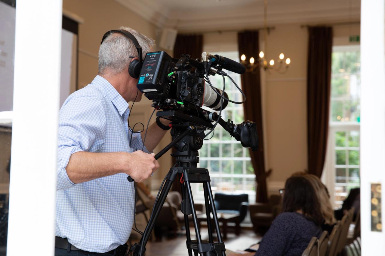 camera operator filming an event