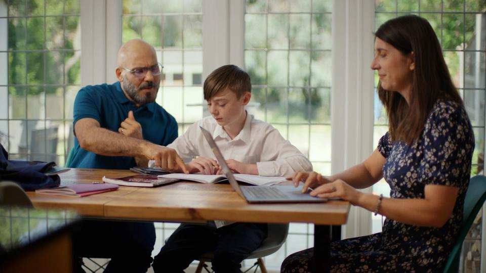 foster parents helping child with homework
