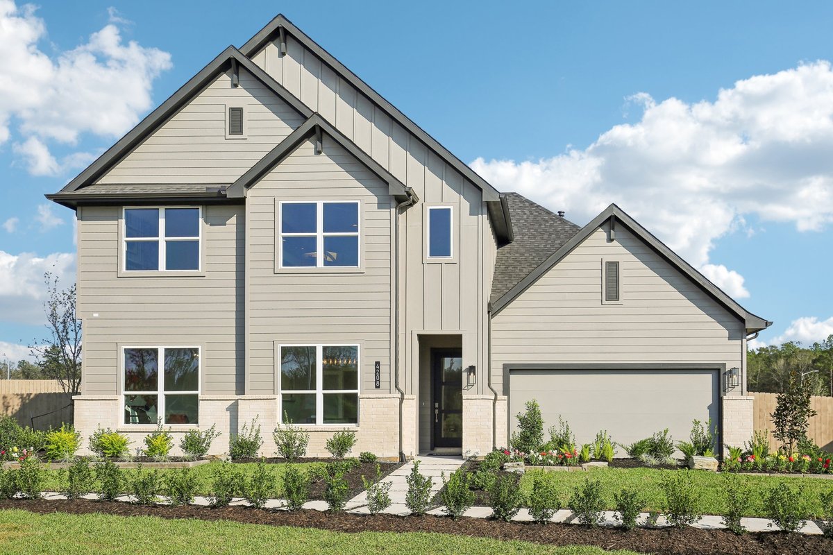 Two-story new construction home with gray siding, dark trim, and a landscaped front yard, from D.R. Horton's Silverthorne community page.