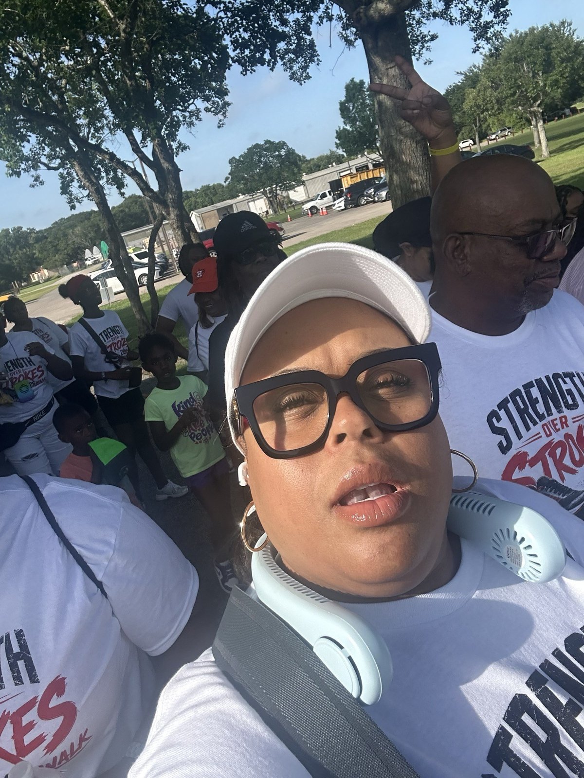A crowd of walkers in matching event shirts gathered for the Strength Over Strokes Walk.