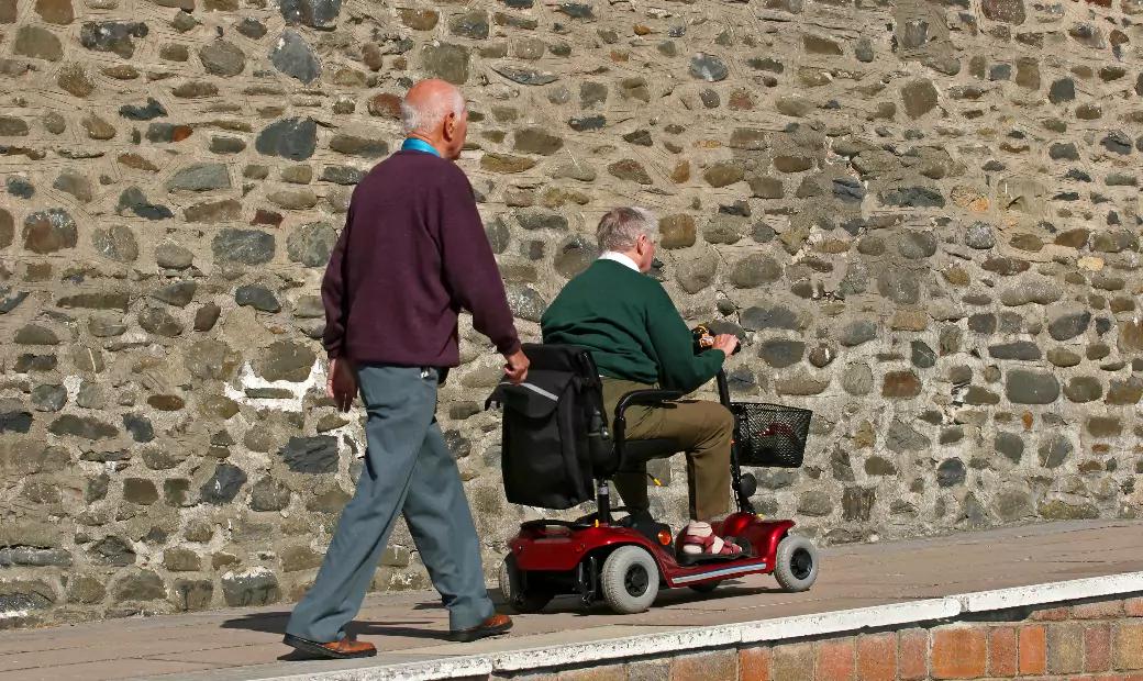 disabled-elderly-man-riding-mobility-vehicle