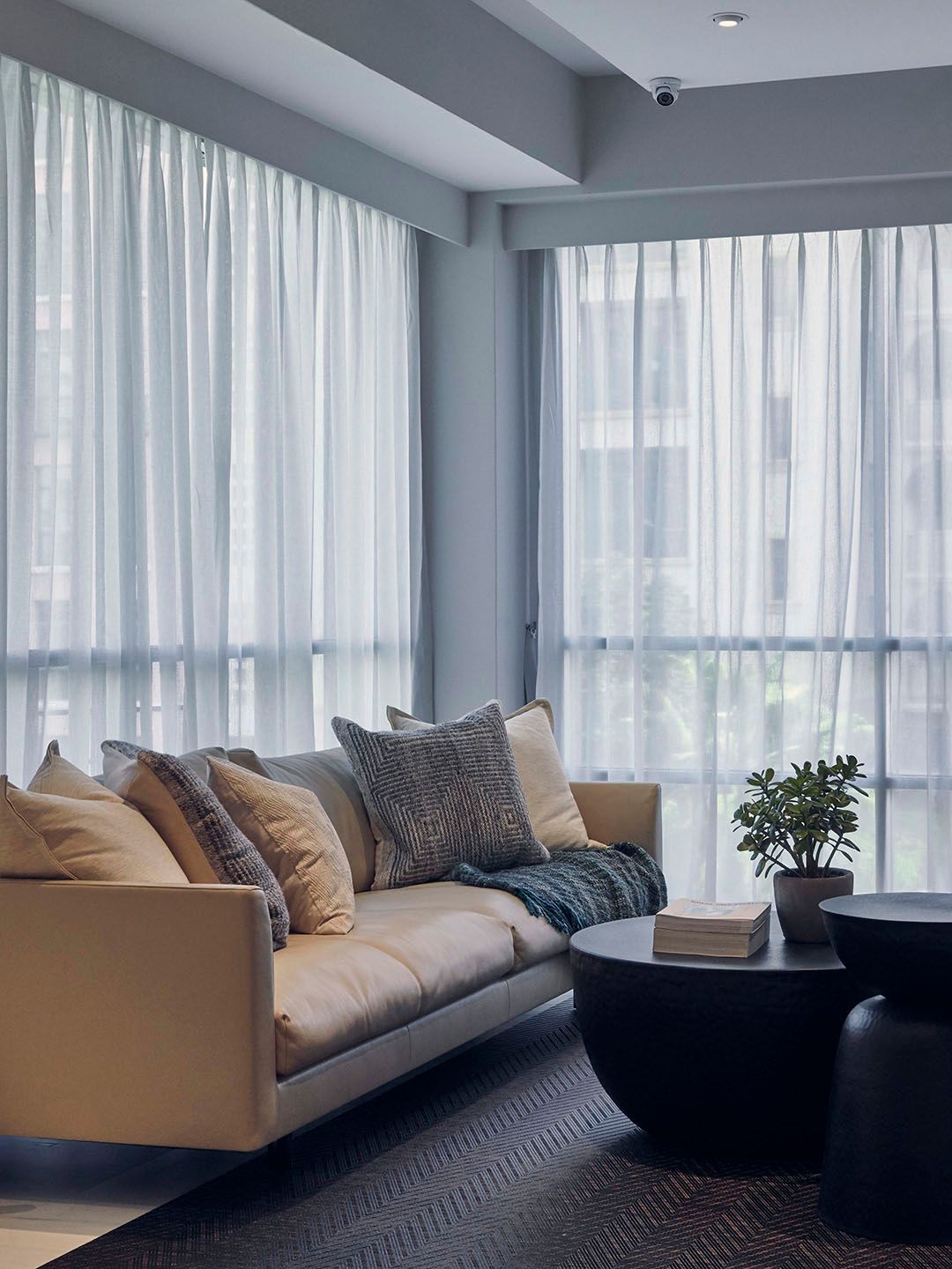Sheer day curtains installed in an apartment living room