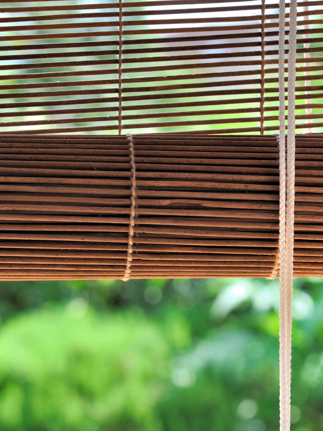 Bamboo blinds on an outdoor balcony in a Singapore home