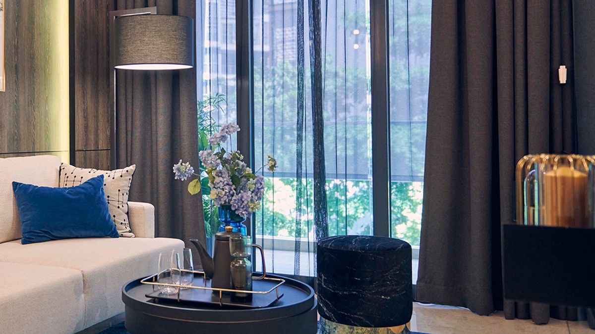 Sheer and Blackout curtains separating the living room from the balcony in an apartment