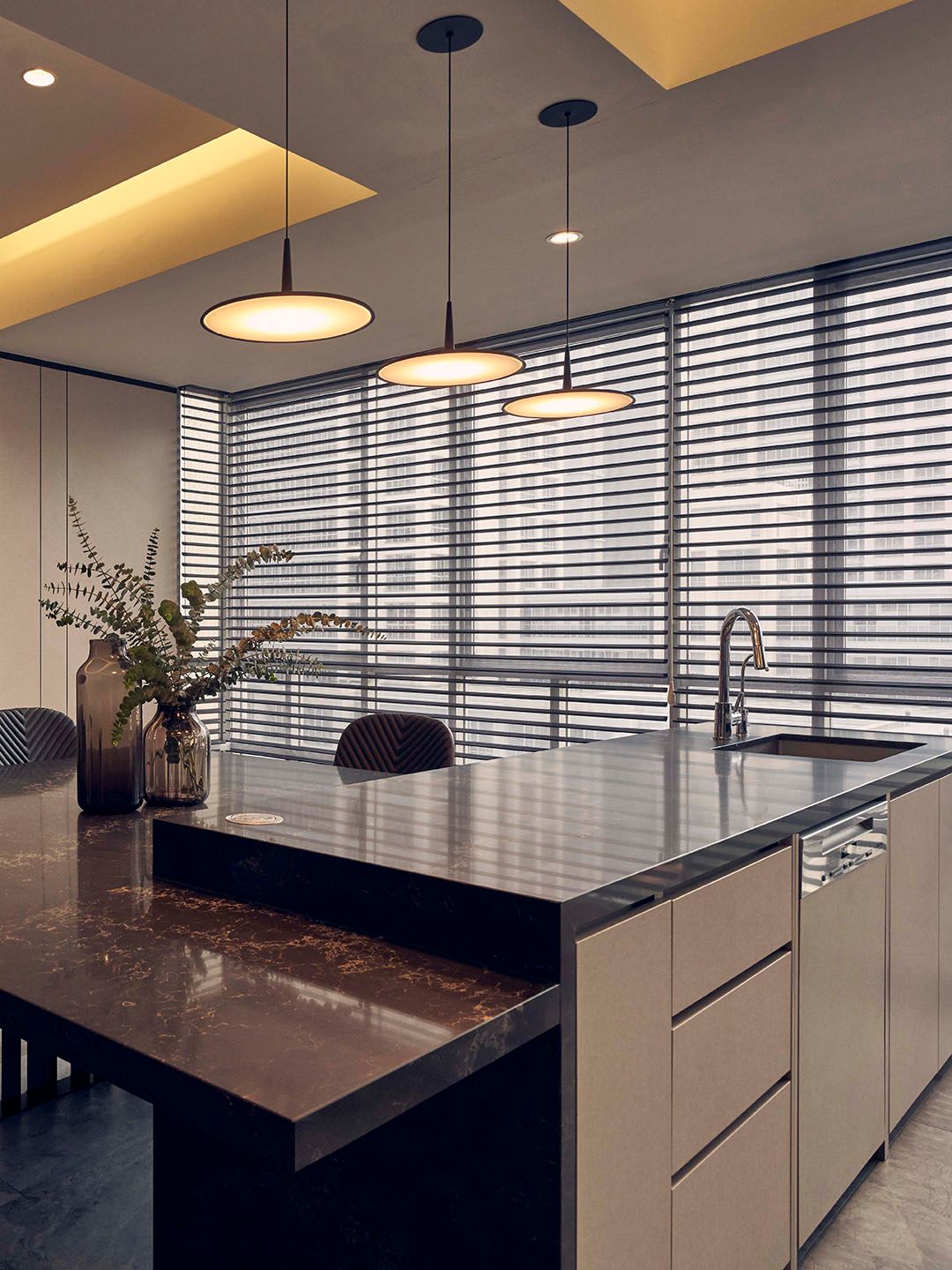 Floor to ceiling window blinds in a condo kitchen