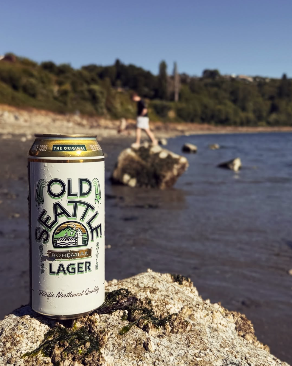A can of Old Seattle with a Pacific Northwest Beach in the background