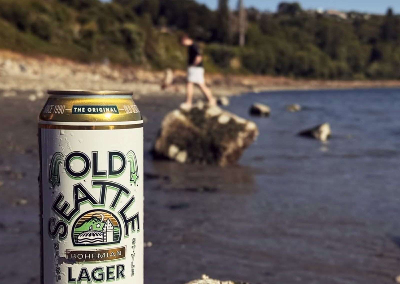 A can of Old Seattle with a Pacific Northwest Beach in the background