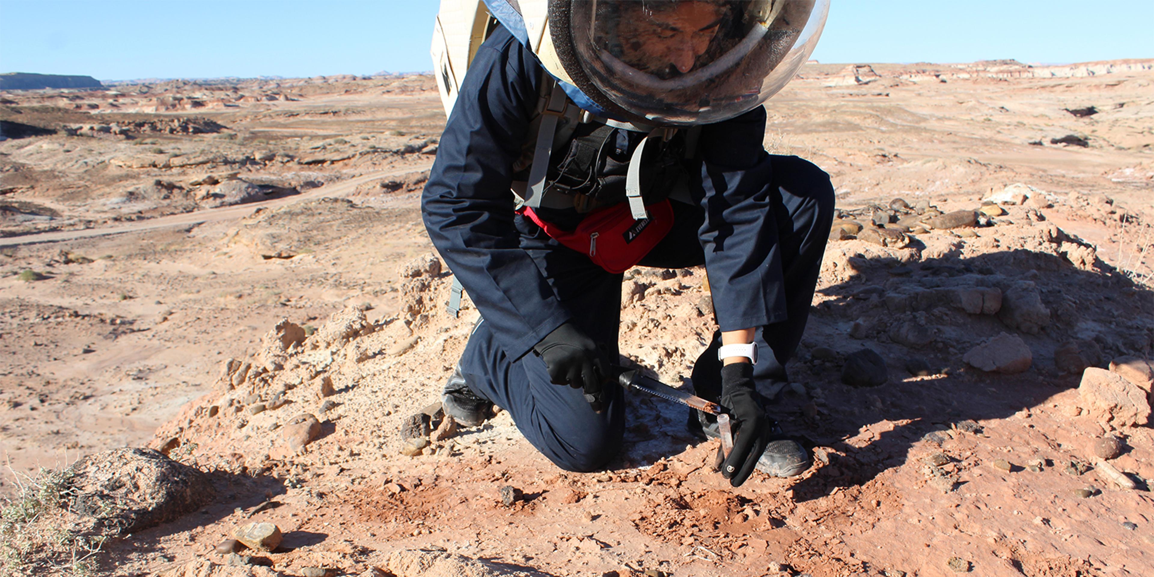 Jas Purewal wearing an EmbracePlus while conducting extravehicular activity in a territory that resembles Mars