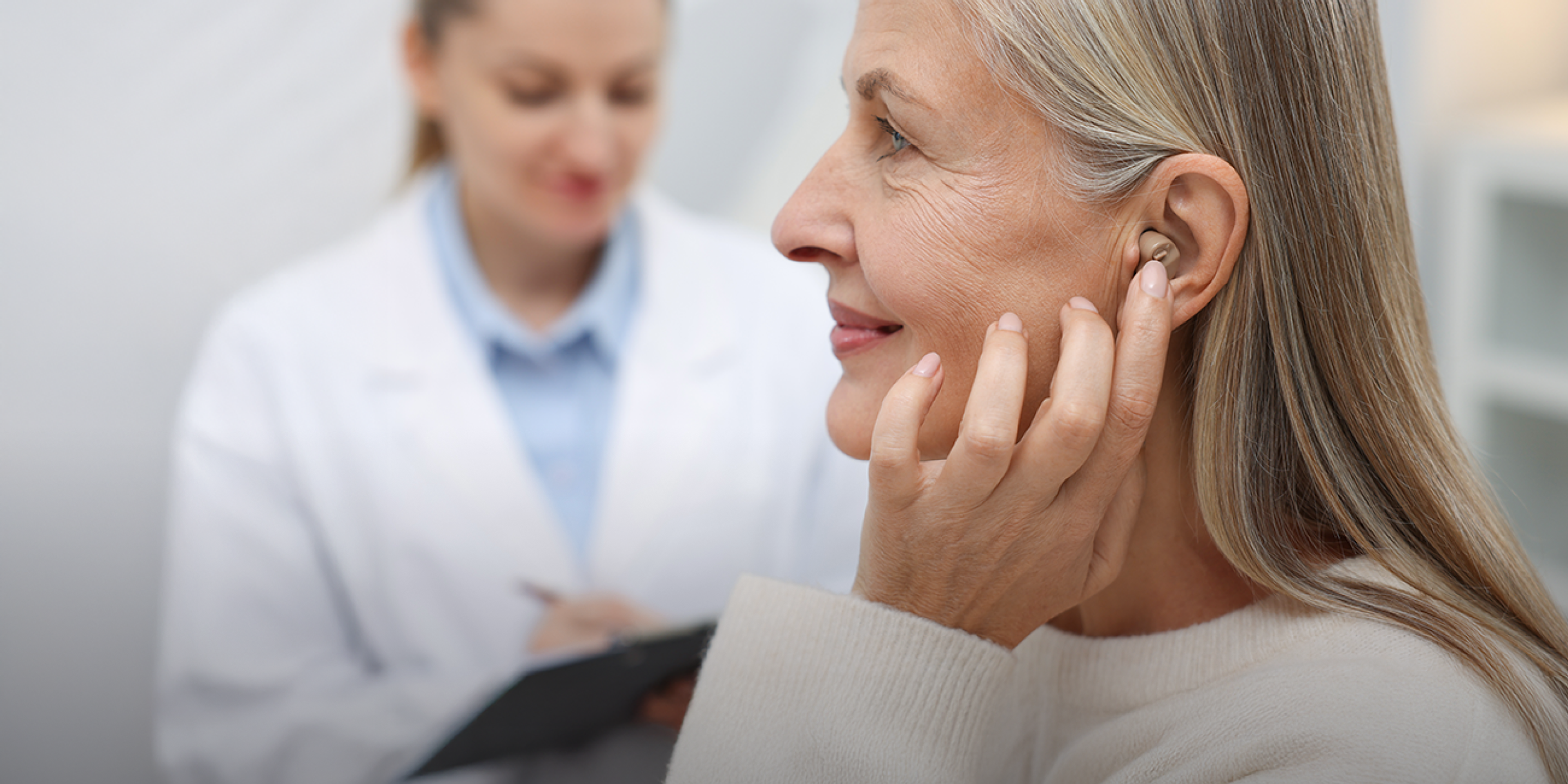 Decoding the cognitive burden of hearing loss through real-world biomarker discovery using EmbracePlus 
