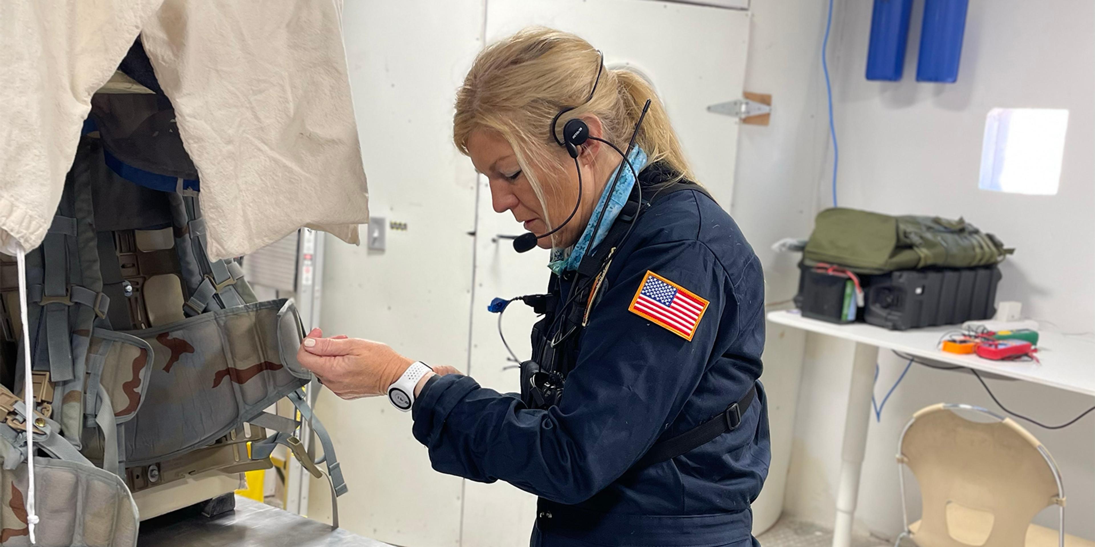 Crew member inside the Analog Missions purpose-built habitat in Utah, wearing an EmbracePlus