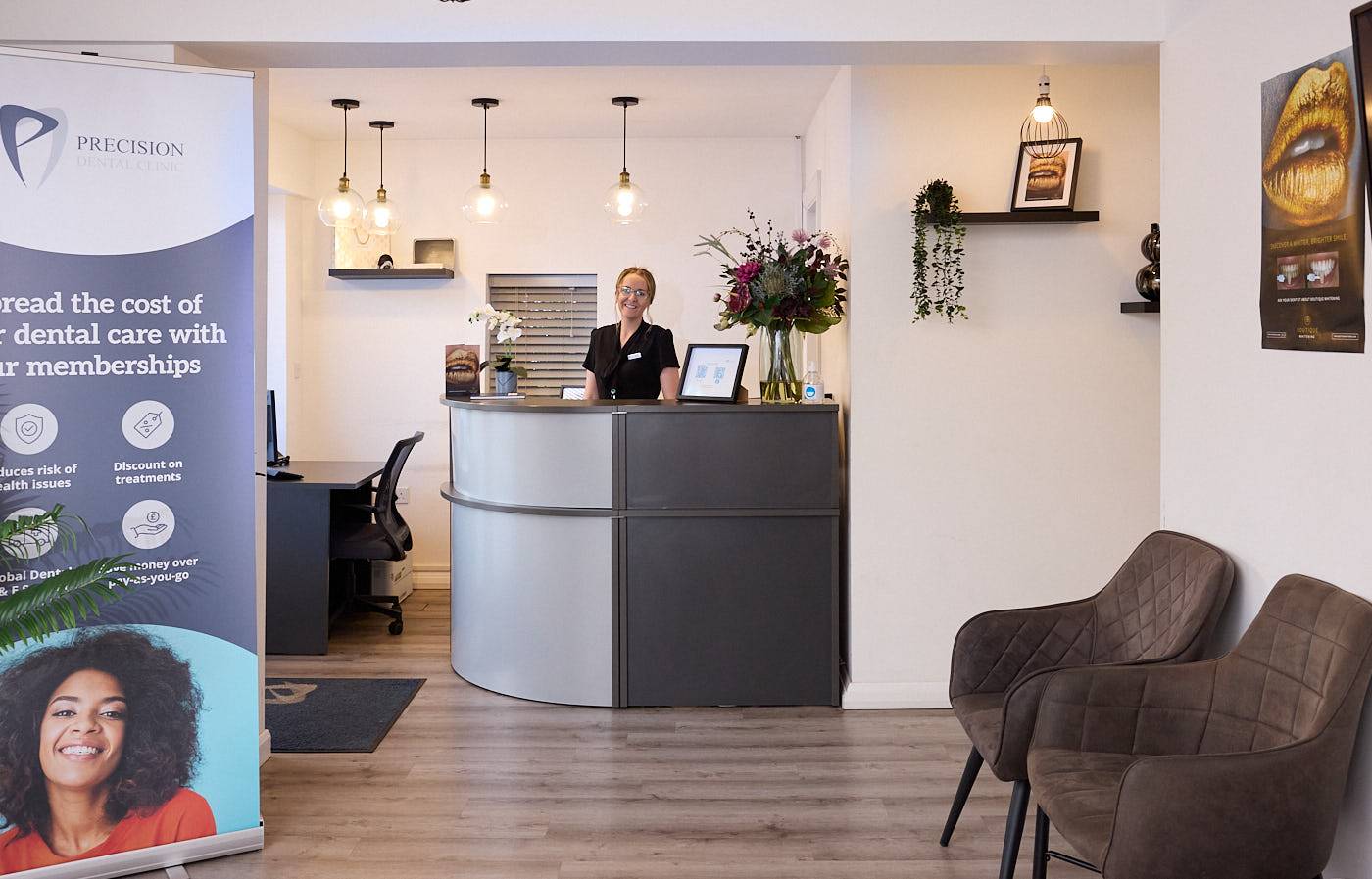 receptionist smiling in dental waiting room