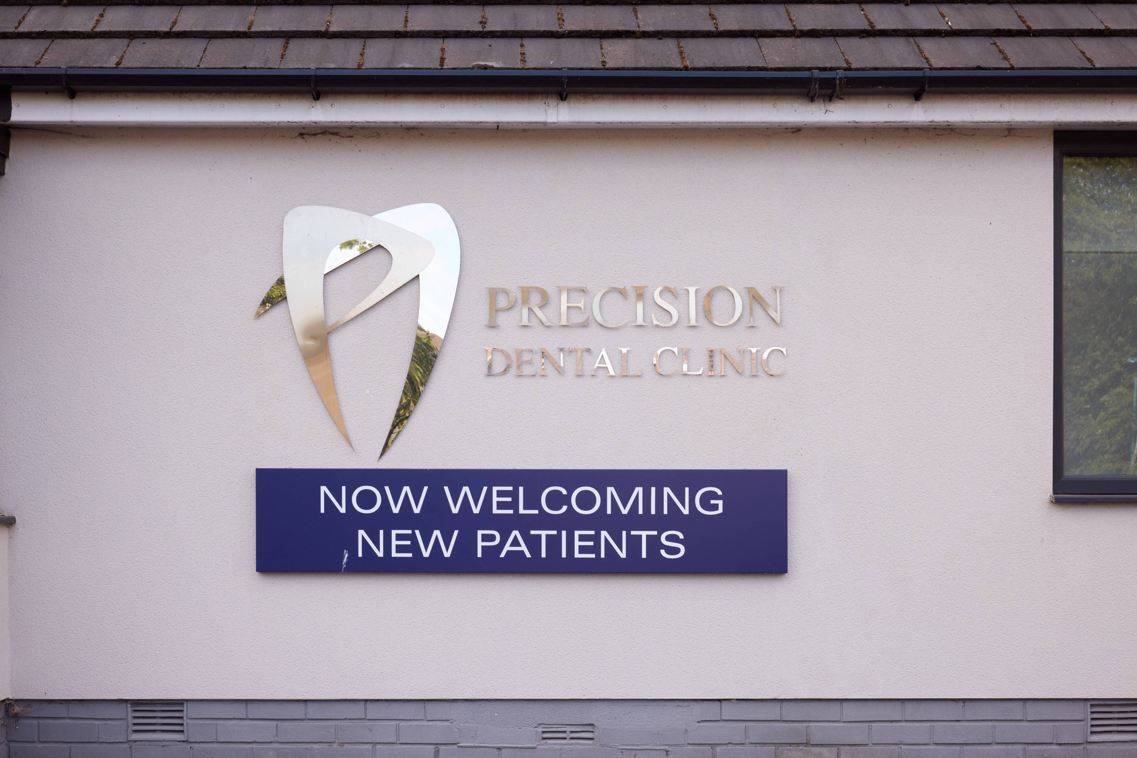 accepting new patients sign outside dental practice in manchester
