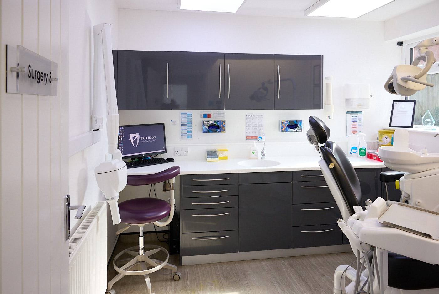 clinician holding an x-ray in dental practice setting