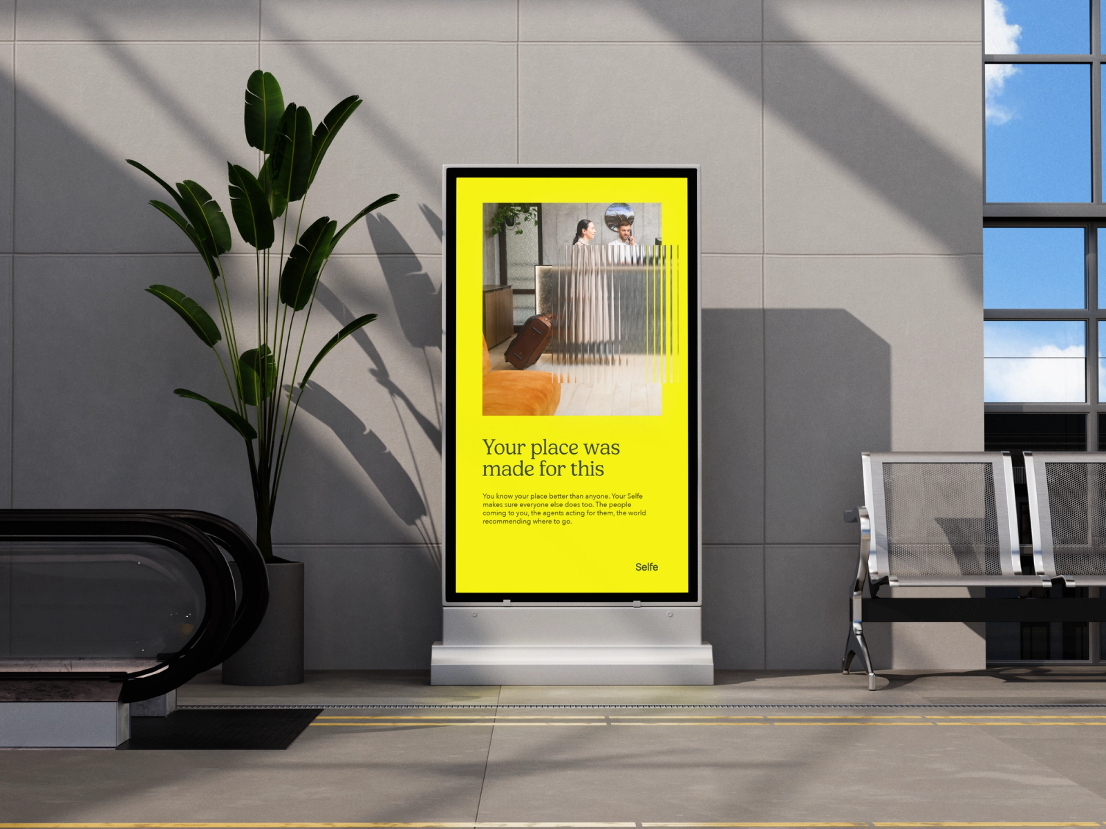 Digital screen advertisement of woman in hotel reception 