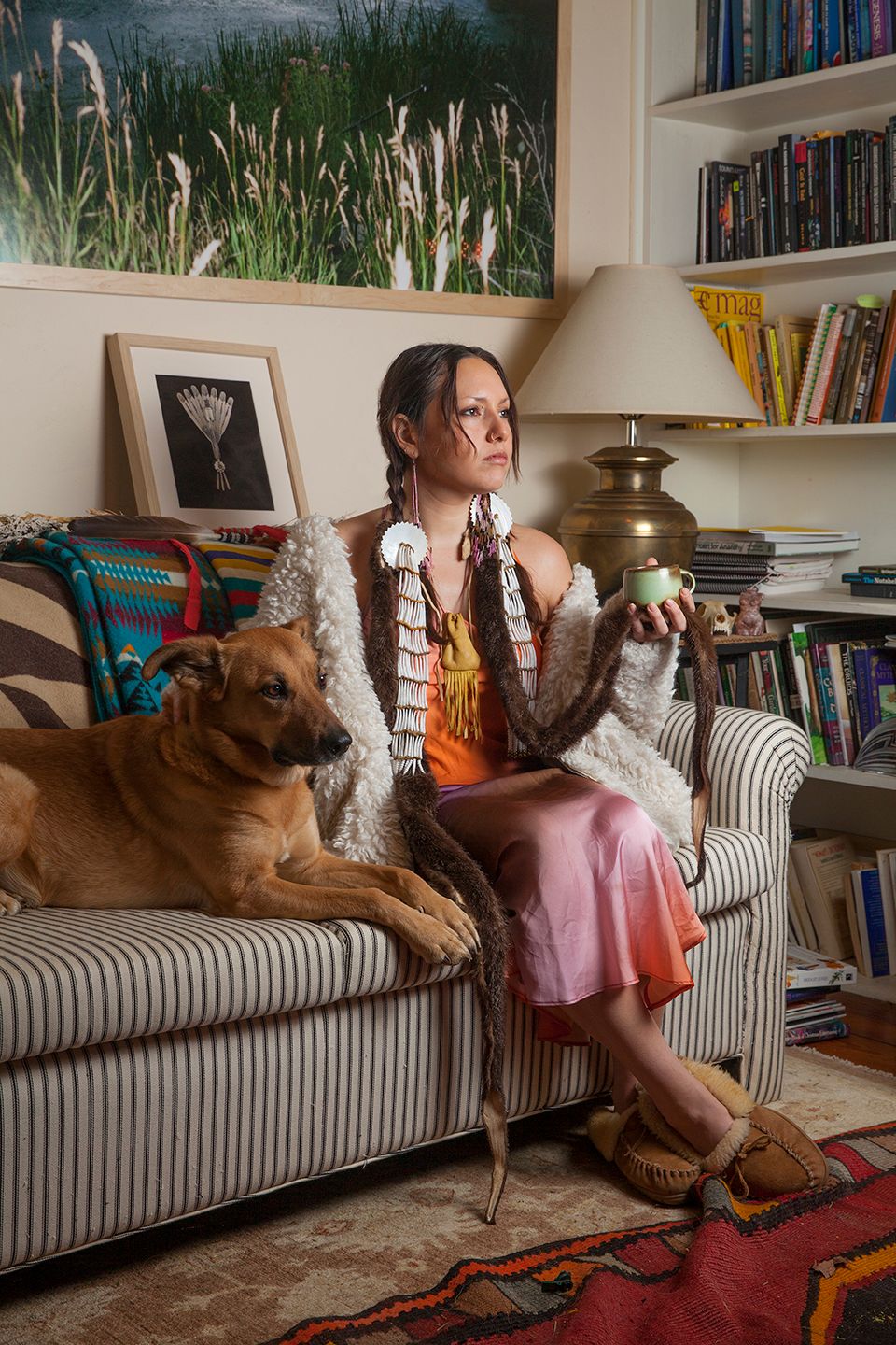 A portrait of Kite at home with her dog