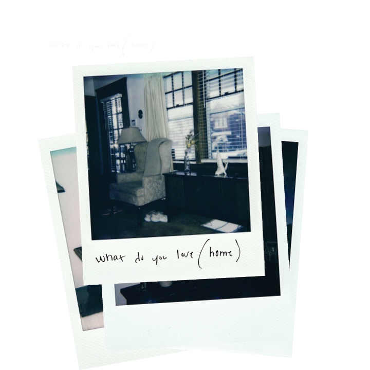 A small stack of Polaroid photographs, the top image of the interior of a house with an armchair and lamp and a handwritten note which says "where do you love (home)"