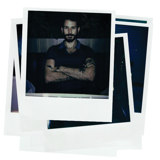 Polaroid photograph of a person with their arms crossed facing the camera