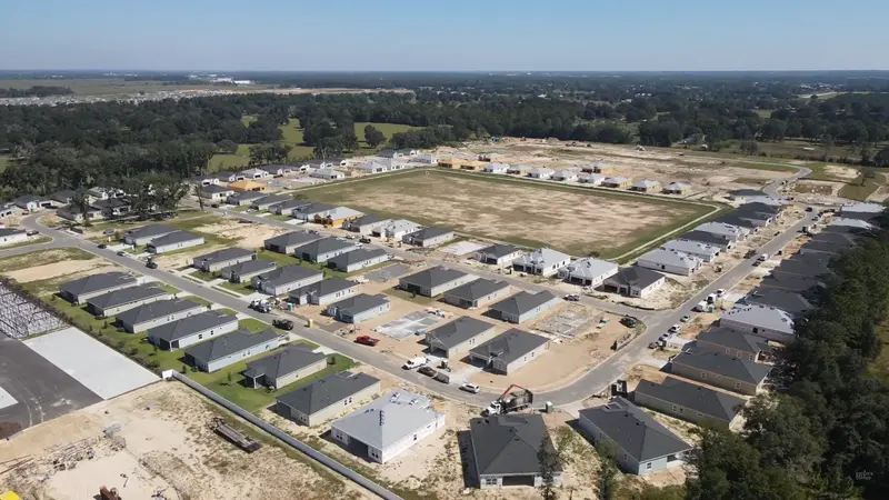 Aerial view of Liberty Village in Ocala, FL, showcasing the extensive 55+ active adult community with numerous homes and green spaces.