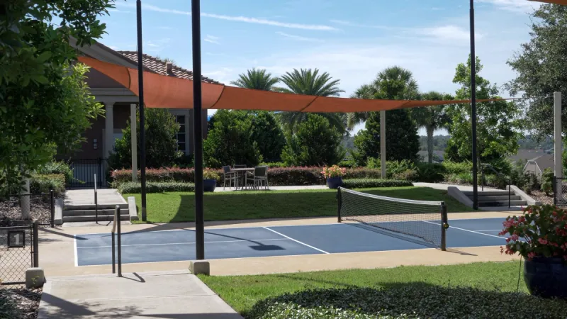 Outdoor Trilogy Orlando pickleball courts covered by sunshades.
