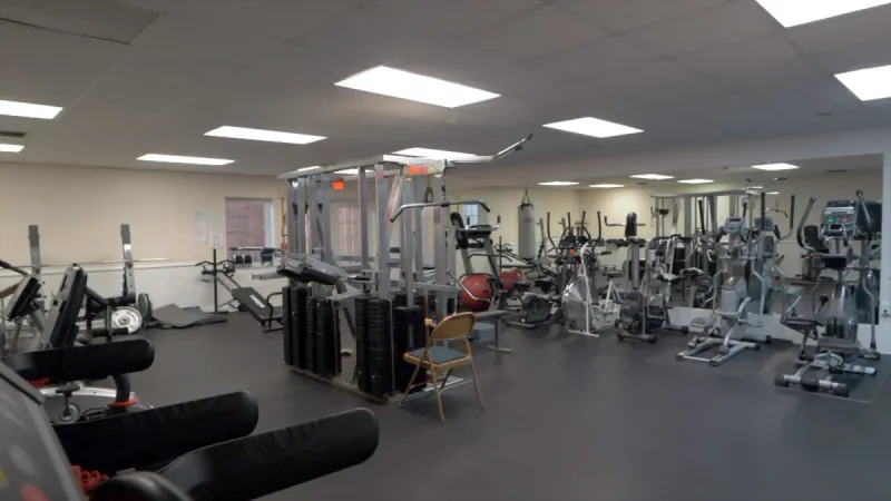 Fully equipped Highland Fairways gym with workout equipment.